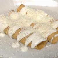 Flautas 3 · Chicken or cheese on a rolled fried tortilla topped with sour cream and cheese served with a...