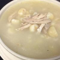 Pozole Blanco De Pollo O Puerco · Hominy soup with pork or chicken served with tostada.