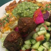 Old Jerusalem Platter · Chumus, Eggplant Salad, Turkish Salad, Mixed Greens, 4 Falafel Balls, and Sours, served with...