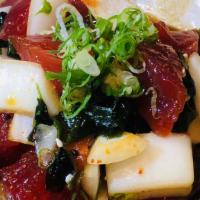 Ahi Poke · fresh tuna, green onions, sweet onion, wakame seaweed with special poke sauce