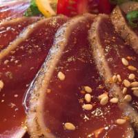 Tuna Tataki · Lightly broiled. Topped with scallions and served with ponzu sauce.