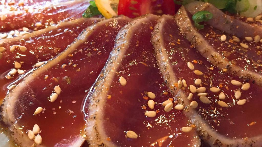 Tuna Tataki · sliced seared tuna with schichimi pepper, top with masago, green onion, ponzu sauce