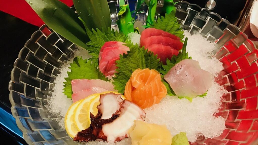 Sashimi Deluxe · Chef's choice of 12 pieces sashimi. Served with soup and salad.