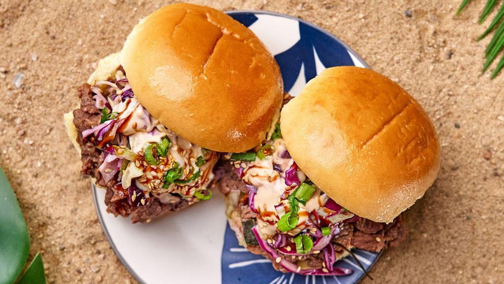 Two Bulgogi Ribeye Sliders · Two of our thinly sliced soy marinated USDA Choice ribeye beef in a bulgogi marinade with a cabbage slaw, pickled cucumbers, and umami shoyu reduction, and truffle essence