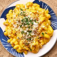 Truffle Mac And Cheese · Macaroni prepared with freshly made cheese sauce, beurre noisette, bread crumbs and white tr...