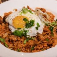 Kimchi Fried Rice · Pan-fried rice, kimchi, mushroom, assorted vegetables, pork belly, and poached egg.