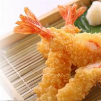 Shrimp Tempura · Crispy fried battered shrimp and vegetables with dipping sauce.