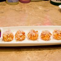 Wild Shumai · Lightly fried shumai topped with wasabi, bonito, sesame and spicy sauce.