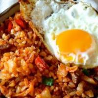 Emperor Fried Rice · Hibachi fried rice with chicken, steak, shrimp, and topped with over easy fried egg.