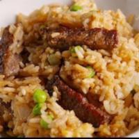 Angus Steak Fried Rice · Fried rice with steak, egg, onion, carrot, and scallion.