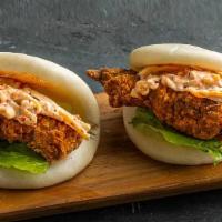 Fried Chicken Bao (2 Pieces) · Fried white meat chicken with cucumber, scallion, Japanese BBQ sauce and spicy mayo.