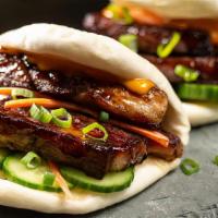 Spicy Pork Belly Bao (2 Pieces) · Braised pork belly with cucumber, scallion, jalapenos and sriracha sauce.