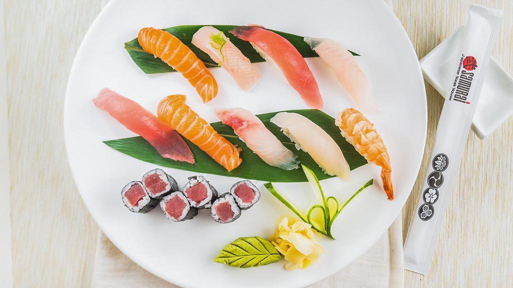 Sushi Deluxe · Nine pieces of nigiri sushi and tuna roll.