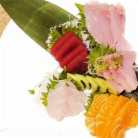 Sashimi Regular (13 Pieces) · Assorted fillets of fresh raw fish.