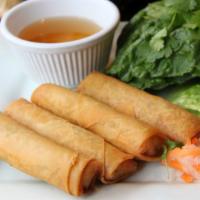 Chicken Eggrolls · Chicken egg rolls served with fresh mint, cilantro, and green leaf lettuce.