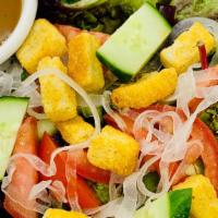 Garden Salad · Spring mix salad, onion, cucumber, tomatoes, and croutons served with house vinaigrette dres...