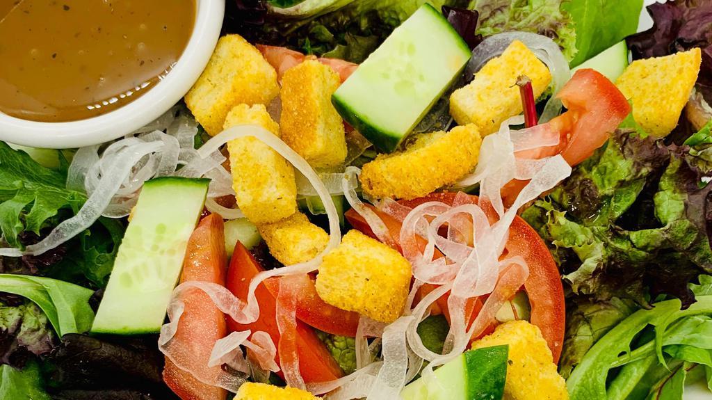 Garden Salad · Spring mix salad, onion, cucumber, tomatoes, and croutons served with house vinaigrette dressing.
