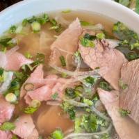 Steak & Brisket Pho · Most popular. Beef broth with rice noodles, rare steak, and beef brisket. Garnished with oni...