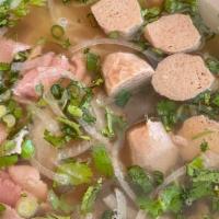 Steak & Meatballs Pho · Beef broth with rice noodles, rare steak, and beef meatballs. Garnished with onions, cilantr...