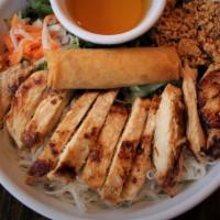 Noodles With Chicken & Eggroll Bowl · Vermicelli rice noodles with grilled chicken and Vietnamese egg roll served with a bed of sh...