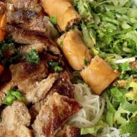 Noodles With Pork, Shrimp & Eggroll Bowl · Vermicelli rice noodles with grilled pork and shrimp and a Vietnamese egg roll served with a...