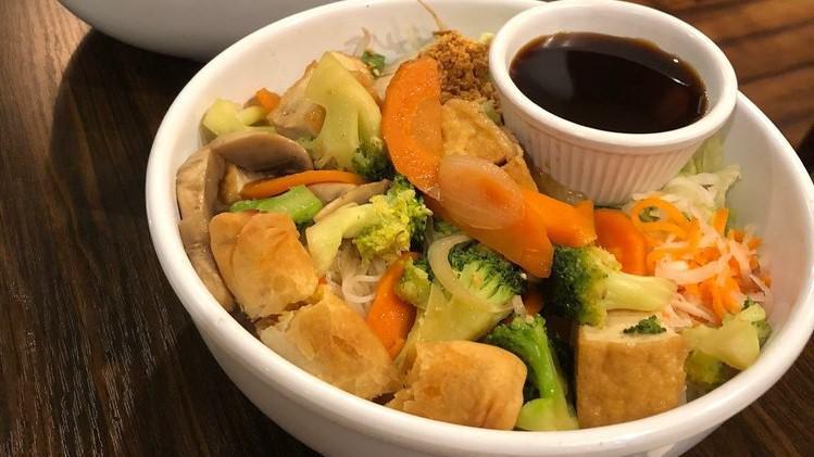 Noodles With Tofu & Vegetables · Vermicelli rice noodles with strips of tofu, mushrooms, bok choy, broccoli, carrots, onions, crushed peanuts, and a vegetarian egg roll.