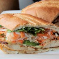 Grilled Chicken Sandwich · Served on a light, crispy baguette with mayo, cucumber, jalapeño, cilantro, pickled radish, ...
