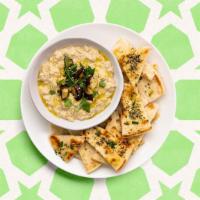Baba Ghanoush & Pita · Pita bread with roasted eggplant blended with garlic, tahini, lemon, and touch of olive oil.