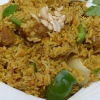 Lamb Biryani · Moist pieces of lamb leg cubed and sautéed with bell peppers onions and fragrant basmati rice.