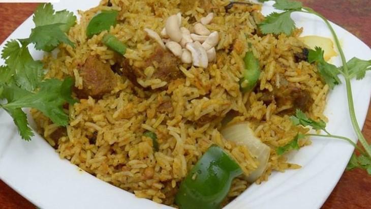 Lamb Biryani · Moist pieces of lamb leg cubed and sautéed with bell peppers onions and fragrant basmati rice.