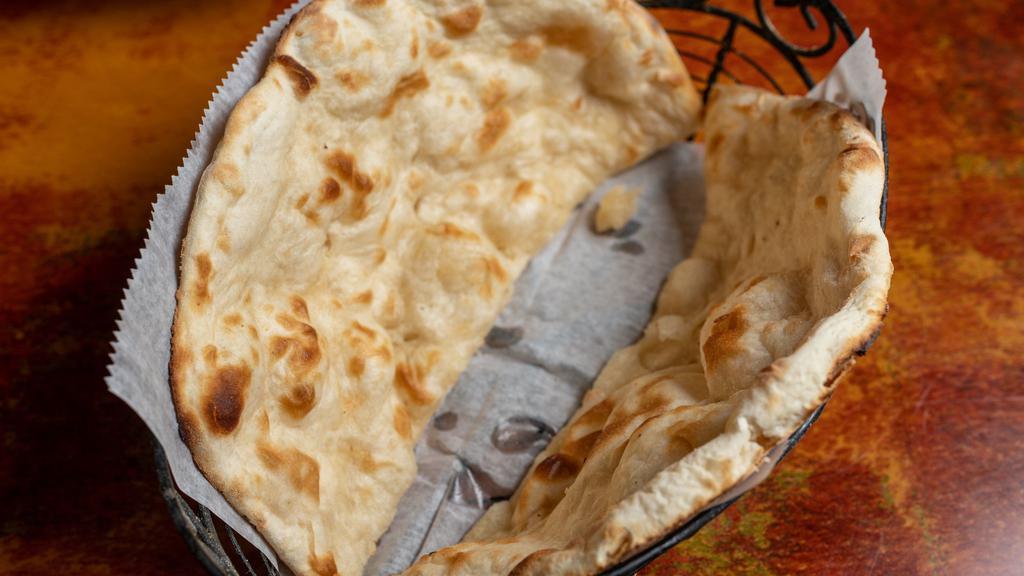 Naan · This traditional tear-drop whole flour bread.