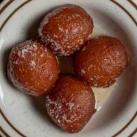 Gulab Jaman · Juicy deep fried cheese ball dipped in syrup.