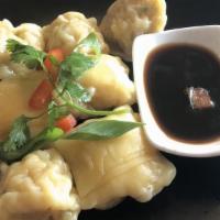 Steamed Ravioli · Steamed ravioli stuffed with shrimps, fresh crabmeat and herbs, served with house dipping sa...