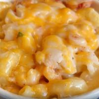 Lobster Mac & Cheese · Creamy macaroni and cheese covered in Maine lobster.