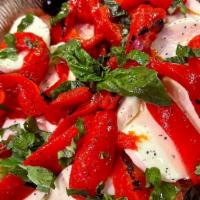 Large Insalata Caprese · Fresh mozzarella, sliced tomatoes, roasted peppers with olives topped with basil and olive o...