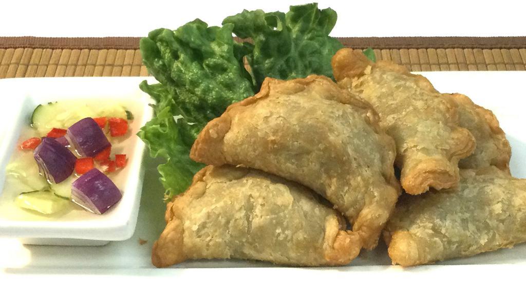 Curry Puff · Soy sauce, gluten, wheat. Chicken / onion / potato / curry powder / stuffed in pastry dough / cucumber sauce