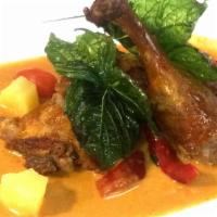 Duck Curry · Mild Spicy. Half duck in red curry / coconut milk / tomato / pineapple / bell pepper / basil...