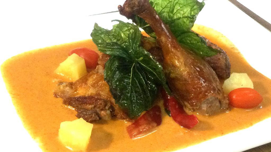 Duck Curry · Mild Spicy. Half duck in red curry / coconut milk / tomato / pineapple / bell pepper / basil leaves
