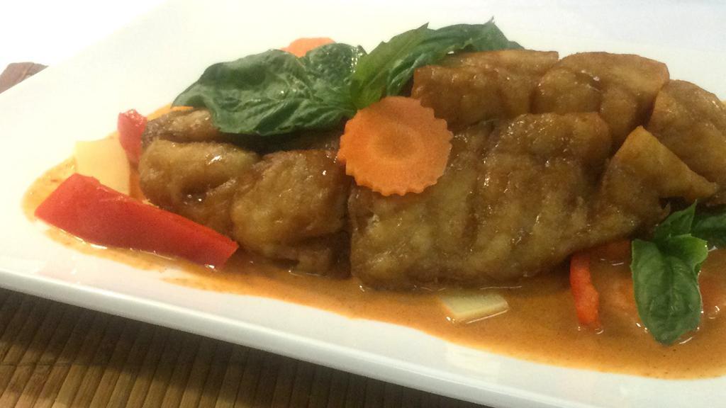 Pla Kang Dang · Mild Spicy. Crispy Fillet  Fish in red curry / coconut milk / bamboo shoots / carrot / bell pepper / peas / basil leaves