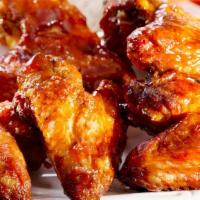 Chicken Wings · Tossed in buffalo or BBQ sauce and served with blue cheese, celery & carrots.