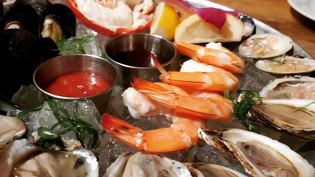 Cold Seafood Platter · daily raw oyster selection, raw clams, cocktail shrimps, chilled lobster tail & mussels w/ black pepper mignonette & cocktail sauce.