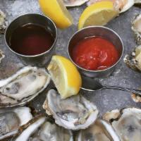 House Oysters · (dozen) oysters on the half shell served over ice with home made cocktail sauce and black pe...