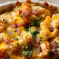 Lobster Mac & Cheese · 4 oz. hand-pulled lobster meat sharp cheddar and mild cheddar topped with pancietta.