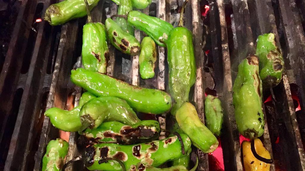 Shishito Peppers · blistered shishito peppers drizzled w/ truffle oil