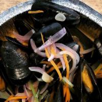 Festival Mussels · steamed pei mussels in curry broth w/ fresh herbs, juliene carrots & celery