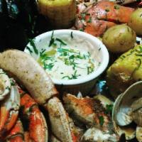Oth Crab Boil · steamed snow crab & mixed seafood, tossed in cajun spices, served w/ side of rice and argent...