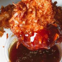 Coconut Shrimp · Coconut battered shrimp fried to a perfect golden brown and served with orange ginger dippin...
