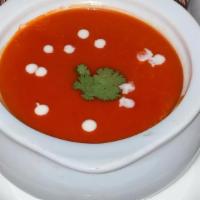 Tomato Soup · Fresh creamy tomato soup blended with herbs and spices.