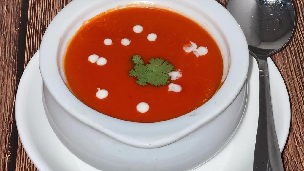 Tomato Soup · Fresh creamy tomato soup blended with herbs and spices.