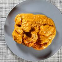 Tikka Masala · Broiled in a tandoor clay oven and smothered in a creamy spicy tomato sauce with onions and ...